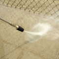 Are there any special considerations when using an oscillating nozzle powered pressure washer?