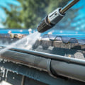 What do you spray on gutters before pressure washing?