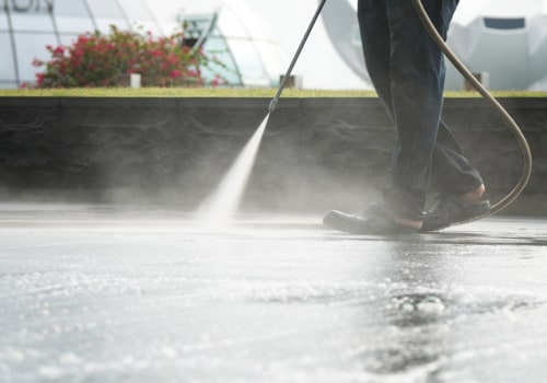 Are there any special considerations when using an adjustable water volume feature on a powerwasher?